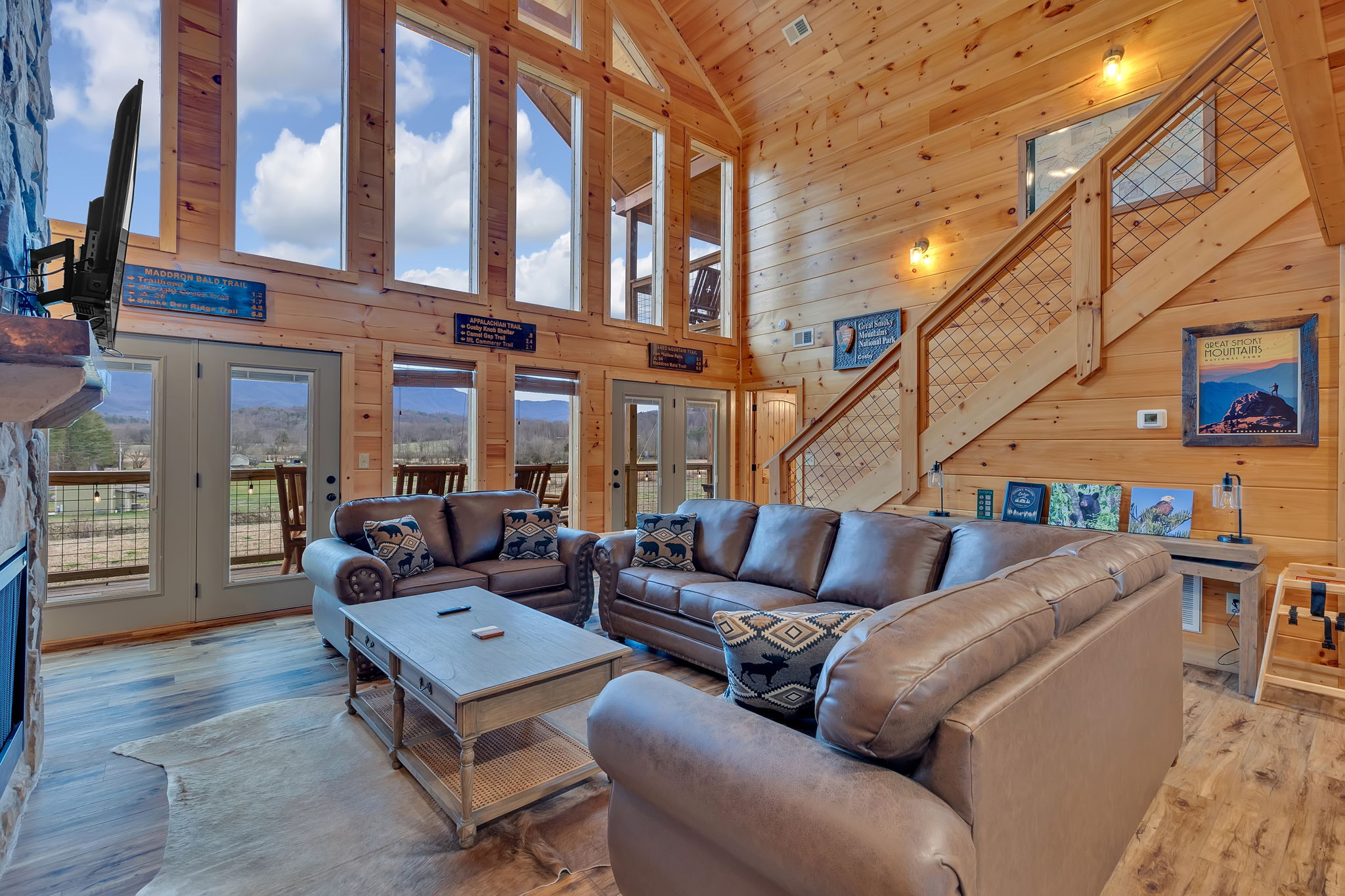 The Smoky Woods Lodge living room with mountain-view windows