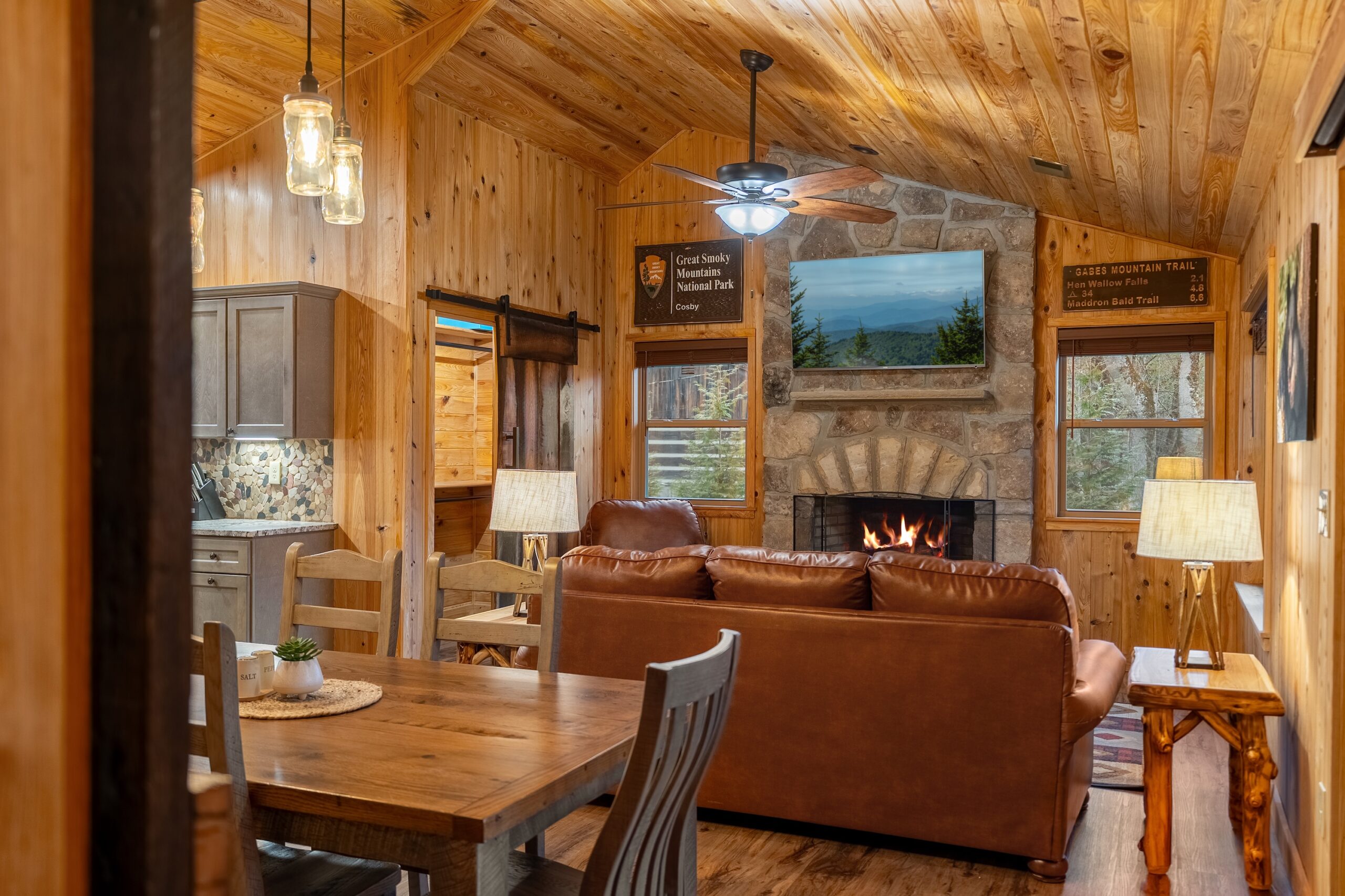 Rivers Edge living room with stone fireplace
